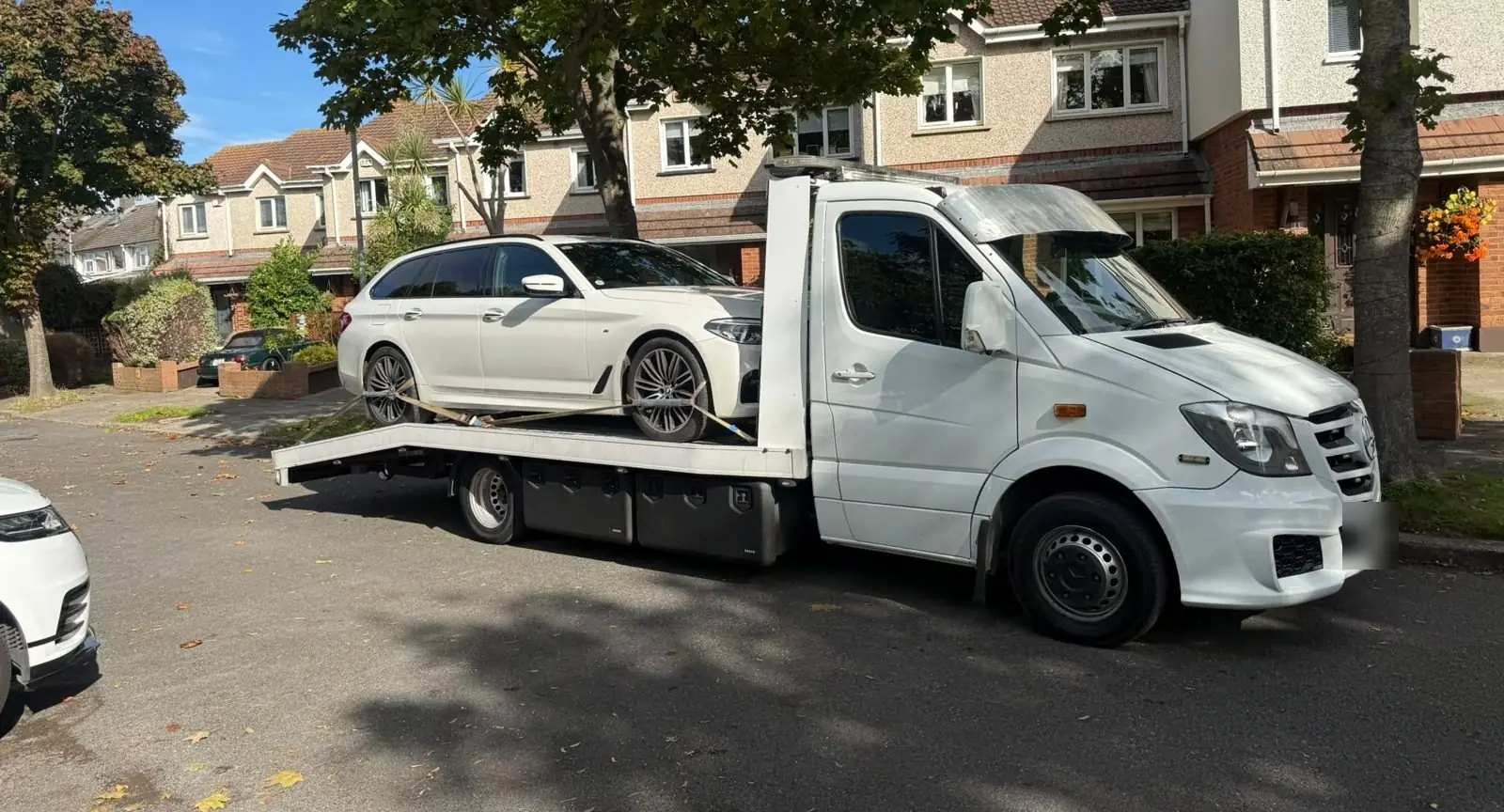 Our white truck parked on a Dublin housing estate on a sunny autumn morning